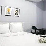 Minimalist Studio At Grand Asia Afrika Apartment By Travelio